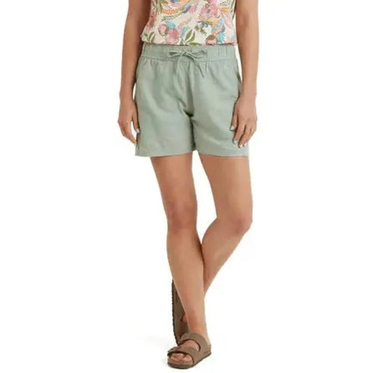 A front view of the Sherpa Adventure Gear Women's Palmo Short in Celery, showing the drawstring waist and model wearing them against a white background.