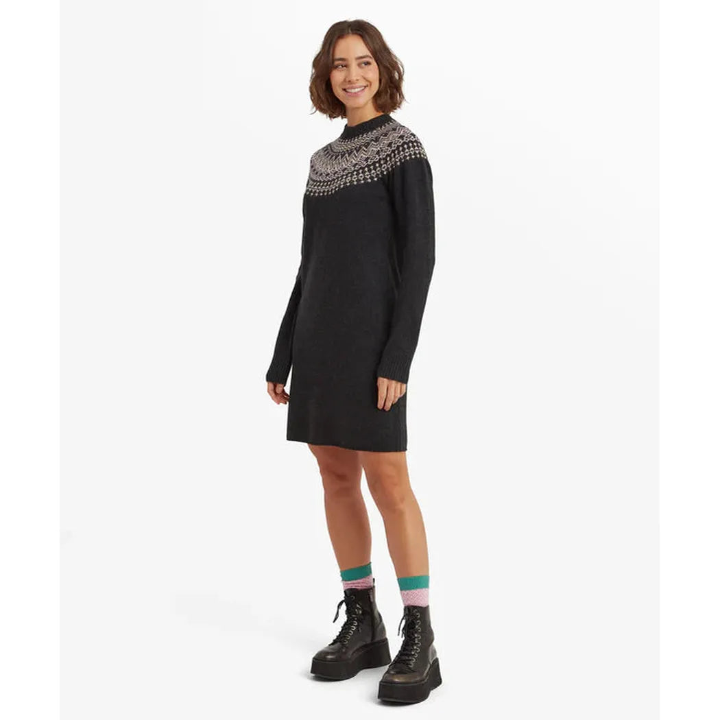 Side view of the Sherpa Adventure Gear Women's Pamu Dress in Black showing the patterned yoke and model wearing it against a white background.