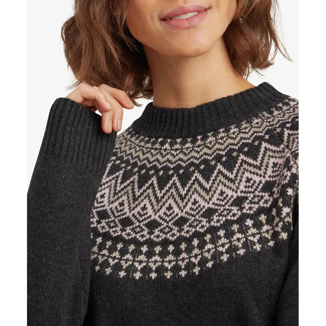 A close-up of the Sherpa Adventure Gear Women's Pamu Dress in Black, showing the patterned design on the chest and a model wearing it against a plain background.