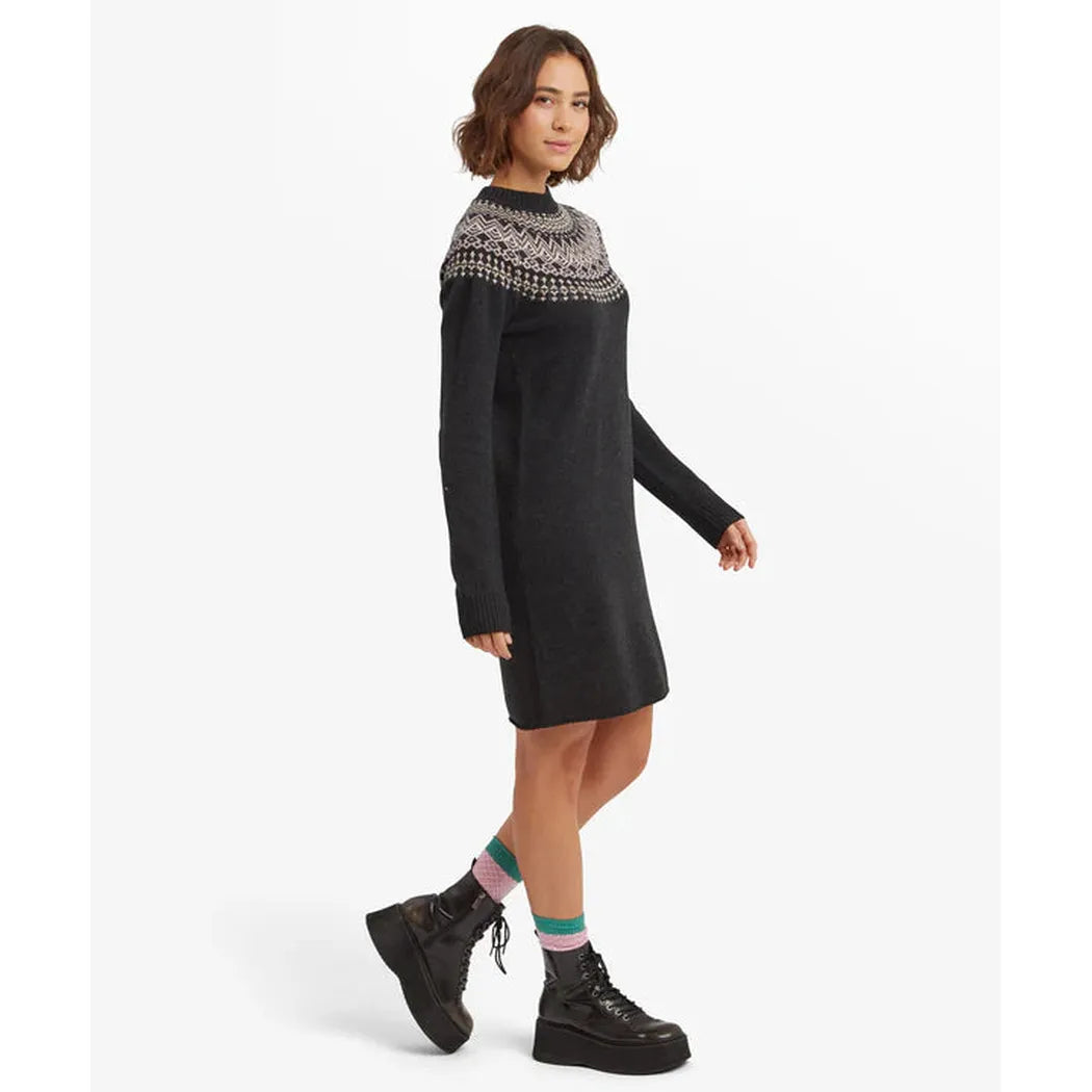 Side view of the Sherpa Adventure Gear Women's Pamu Dress in Black against a white background.