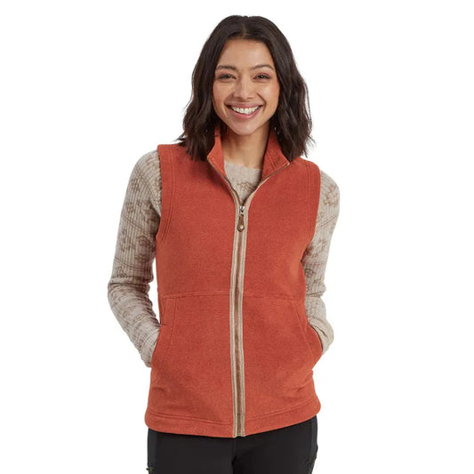 A front view of the Sherpa Adventure Gear Women's Rolpa Eco Vest in Rust on a model with a white background.