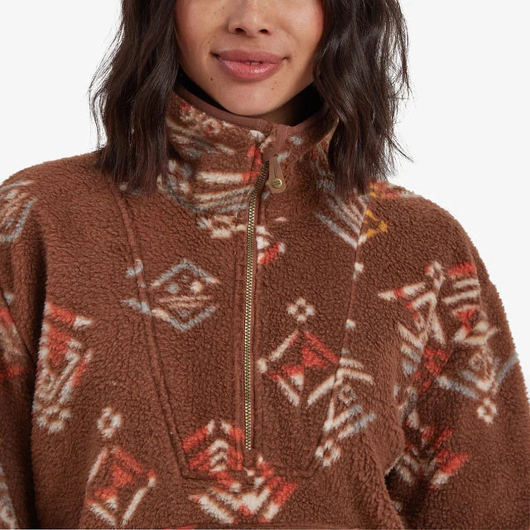A front view of the Sherpa Adventure Gear Women's Uddesya Eco 1/4 Zip in Cappuccino Yathra showing the zipper and pattern on a model.