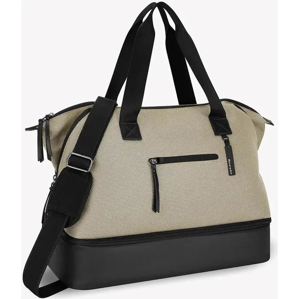 A front view of the Sherpani Eclipse AT bag in Aloe Mist showing the front zip pocket and black base against a white background.