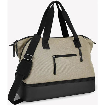 A front view of the Sherpani Eclipse AT bag in Aloe Mist showing the front zip pocket and black base against a white background.