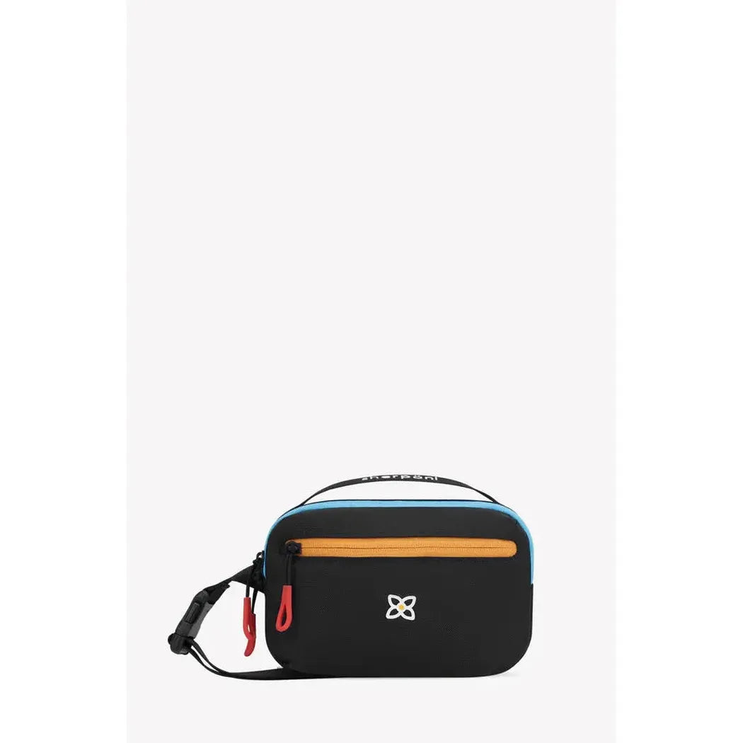 A front view of the Sherpani Hyk Chromatic bag showing the front zipper pocket and adjustable strap against a white background.