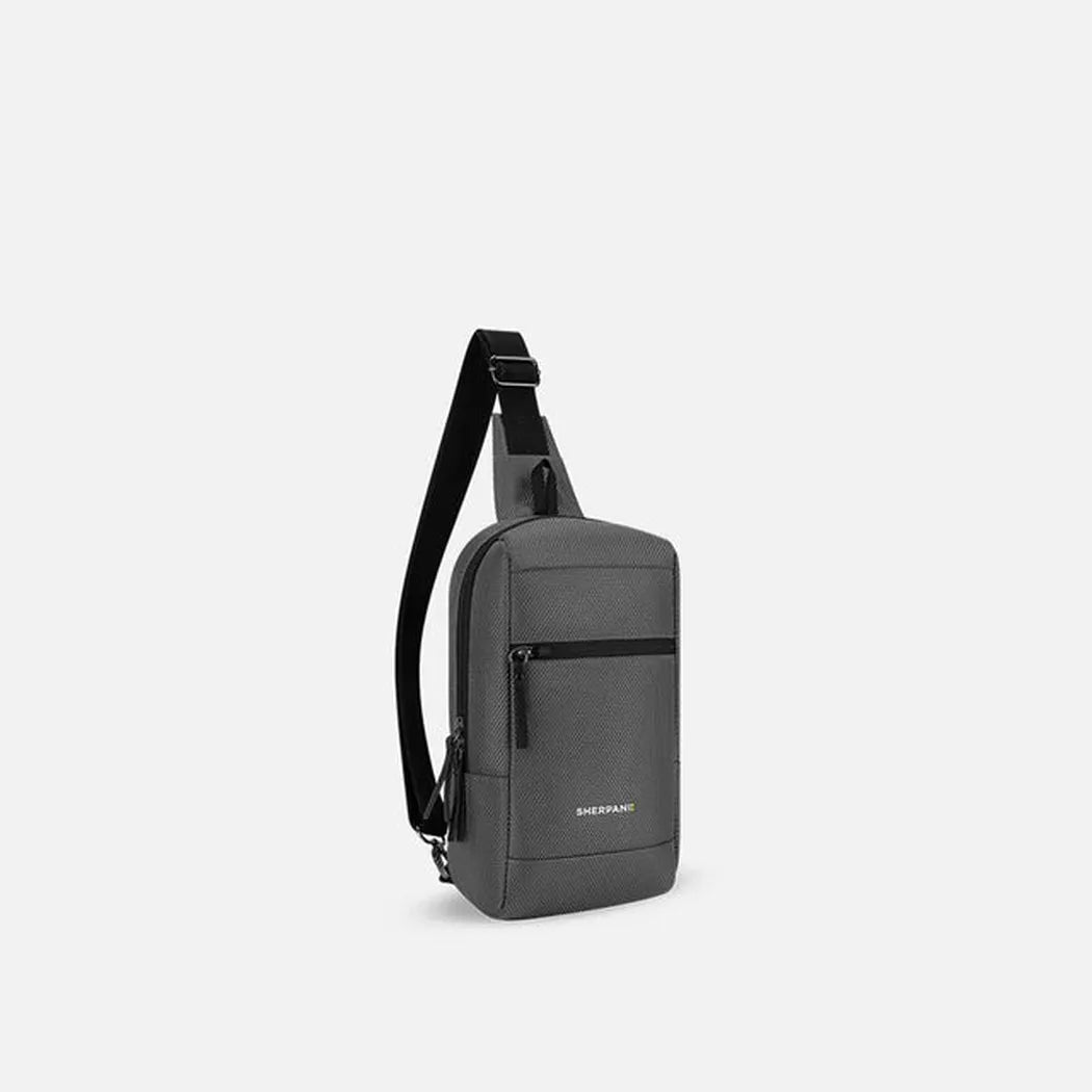 A front view of the Sherpani Metro AT bag in Aloe Mist with a black shoulder strap and front zip pocket against a plain white background.