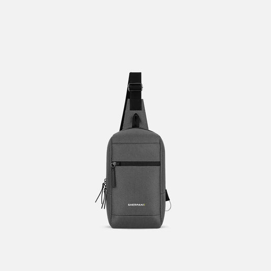 A front view of the Sherpani Metro AT bag in Aloe Mist with a zippered pocket and adjustable strap against a plain white background.