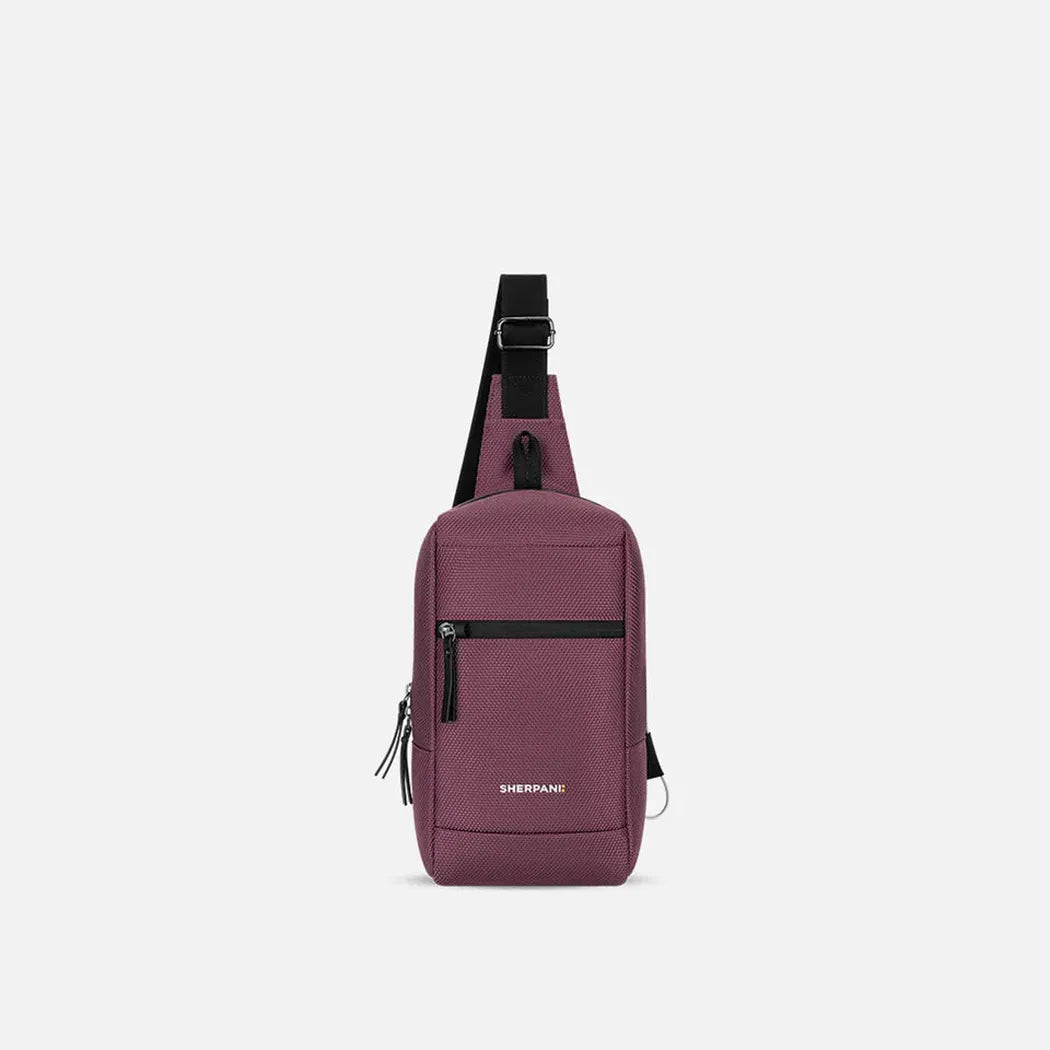 A front view of the Sherpani Metro AT bag in Aloe Mist with a black shoulder strap and front zip pocket against a white background.
