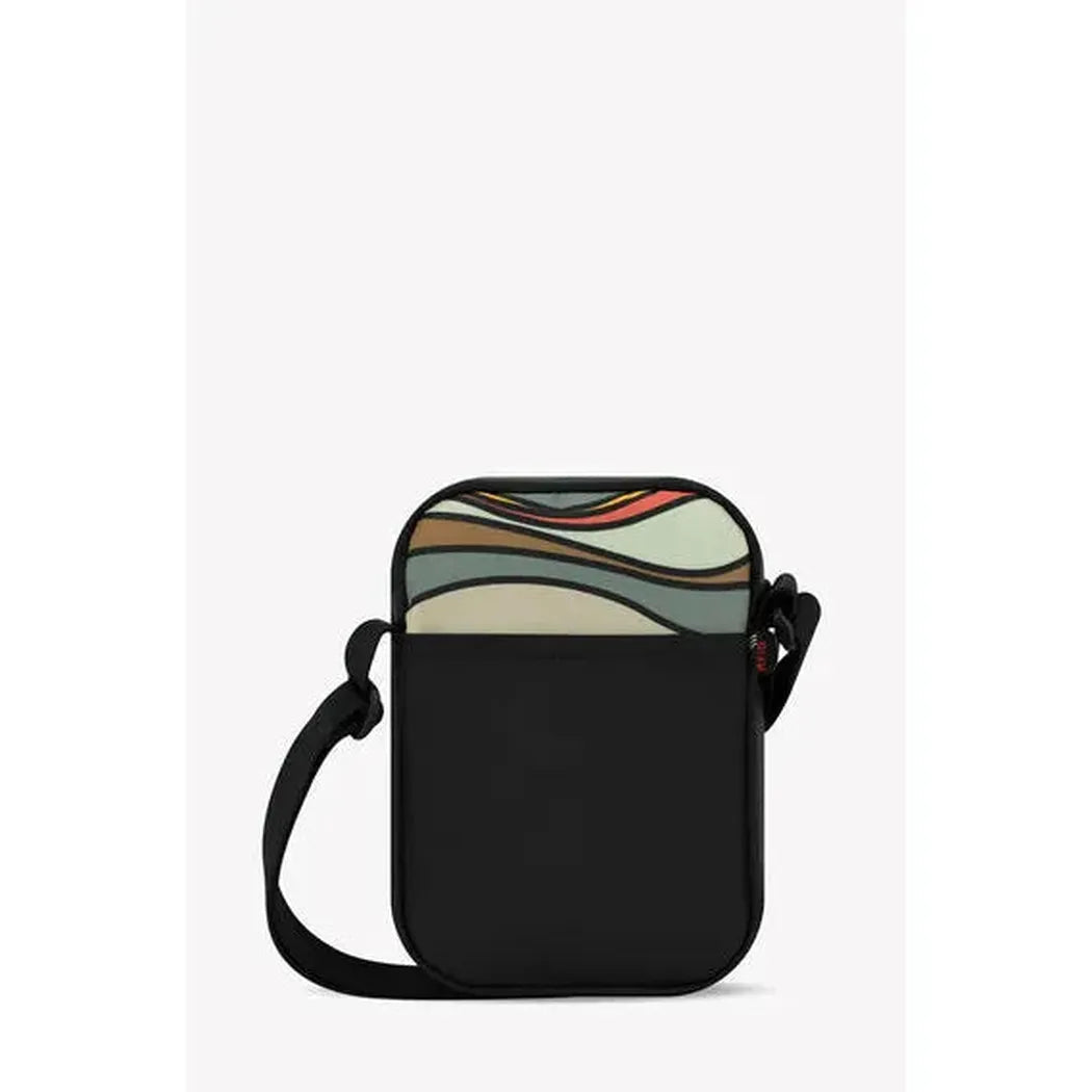 A front view of the Sherpani Rogue Chromatic crossbody bag with a colorful wave pattern on top and a black strap against a white background.