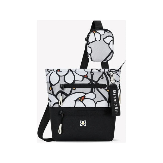 A front view of the Sherpani Sadie with Strap Pocket in Desert showing the front pocket and attached strap pouch against a white background.