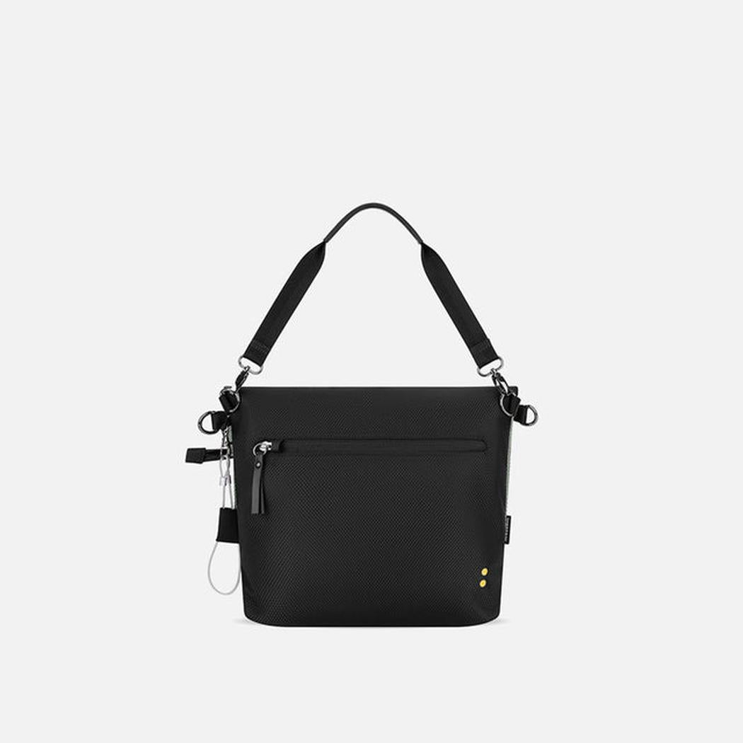 A front view of the Sherpani Vale AT bag in Aloe Mist with a black shoulder strap and a front zip pocket against a white background.