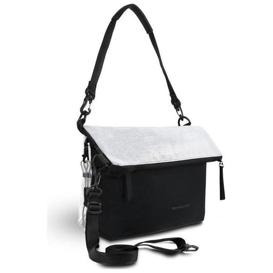A front view of the Sherpani Vale AT bag in Aloe Mist with a black shoulder strap and a white flap, against a white background.