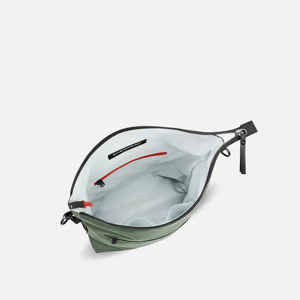 The interior of the Sherpani Vale AT bag in Aloe Mist is shown from a top-down angle with a light gray background.