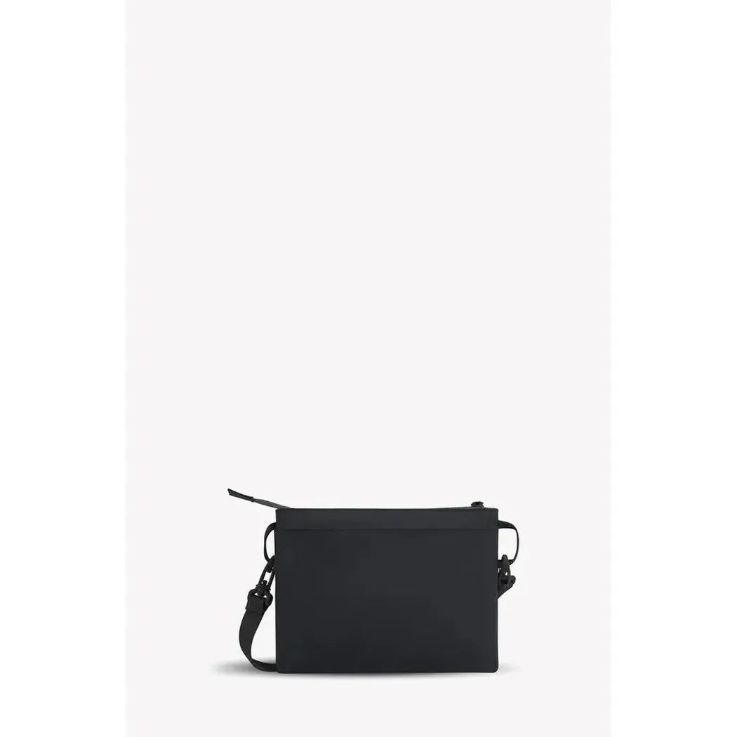 A front view of the Sherpani Zoom bag in Con Leche color with a shoulder strap and zipper closure against a plain white background.