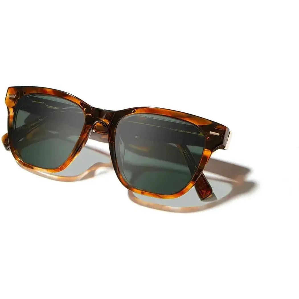 Side view of the Shwood Ankeny sunglasses in Autumn // Elm Burl with dark lenses against a white background.