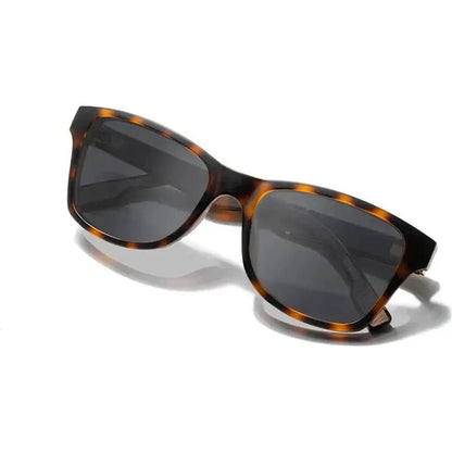 Side view of the Shwood Canby ACTV sunglasses with black and elm burl frames against a white background.