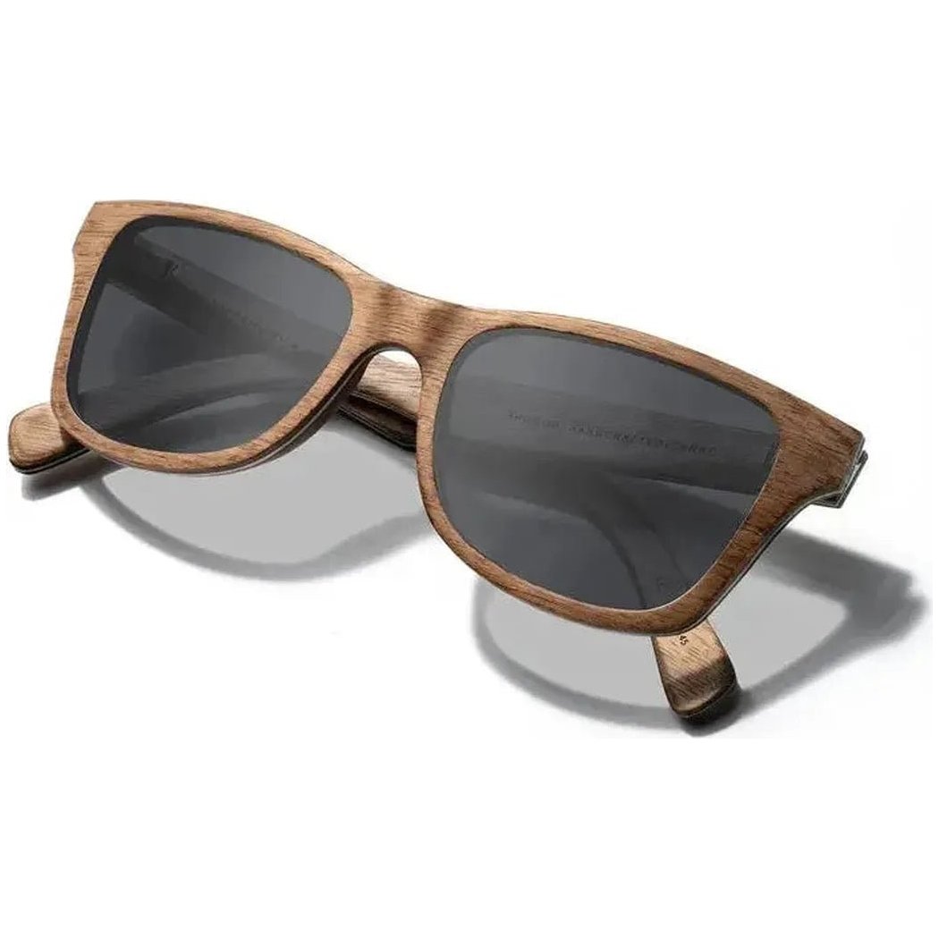 Side view of the Shwood Canby sunglasses in Distressed Dark Walnut with charcoal lenses against a white background.