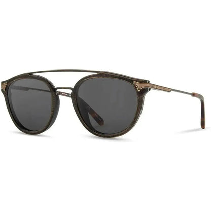 Side view of the Shwood Kinsrow sunglasses with dark lenses and a metal bridge against a white background.