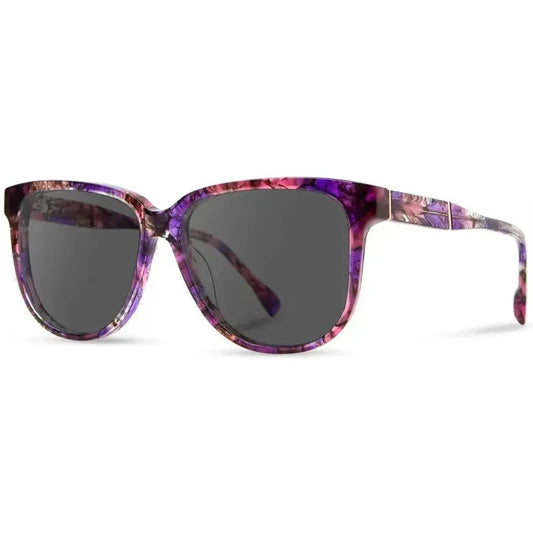 Side view of the Shwood Mckenzie sunglasses in Amethyst with dark lenses against a white background.
