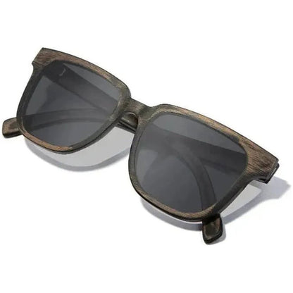 Side view of the Shwood Prescott sunglasses in Distressed Dark Walnut with dark lenses against a white background.