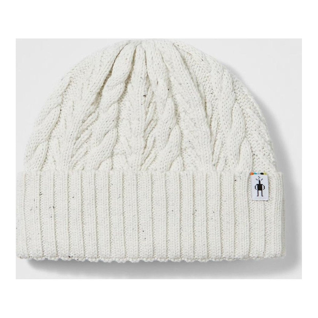 A natural Smartwool Cable Knit Beanie shown from the front with a small logo tag on the cuff against a white background.