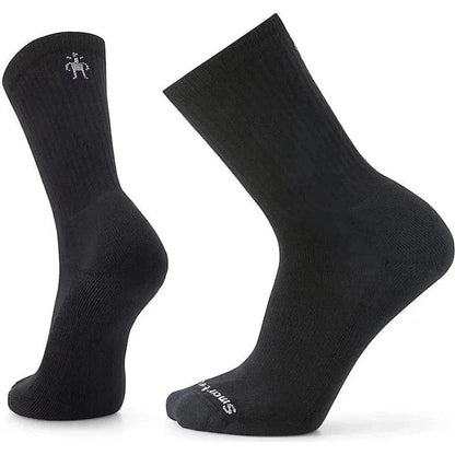 Side view of the Smartwool Everyday Solid Rib Crew Socks in Black showing the ribbed texture and logo on the ankle against a white background.