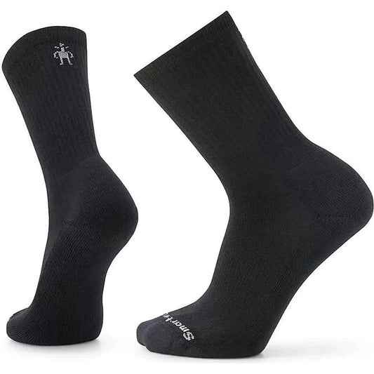 Side view of the Smartwool Everyday Solid Rib Crew Socks in Black showing the ribbed texture and logo on the ankle against a white background.
