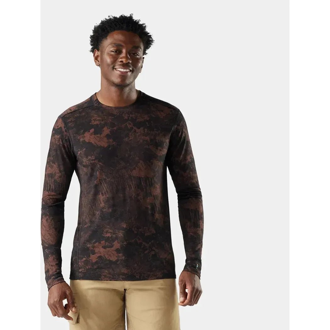 A front view of the Smartwool Men's Classic All-Season Merino Base Layer Long Sleeve in Sable Brown Mountain on a model wearing khaki pants against a plain white background.