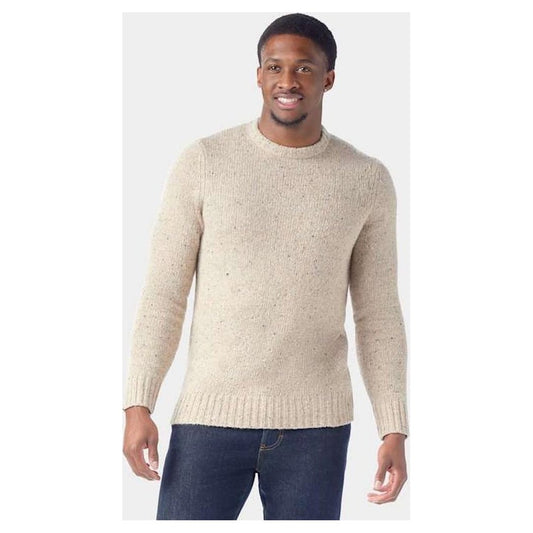 A front view of the Smartwool Men's Heavy Crew Sweater in Oat Heather on a model wearing dark jeans against a plain background.