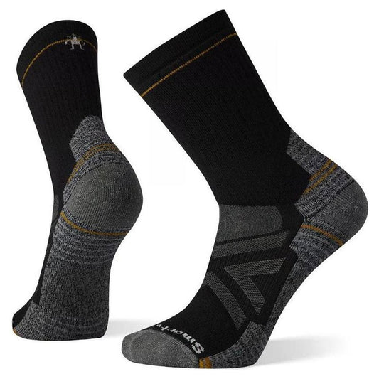 Side view of the Smartwool Performance Hike Full Cushion Crew socks in Black showing the reinforced heel and toe against a white background.
