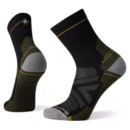 Side view of the Smartwool Performance Hike Light Cushion Mid Crew black socks showing the cushioned heel and toe against a white background.