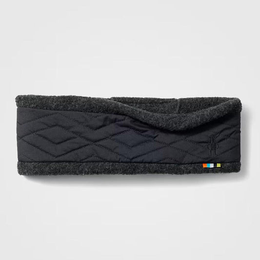 A front view of the Smartwool Quited Fleece Headband in Black with a quilted design and a small colorful tag on the bottom right, against a plain white background.