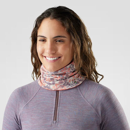 A woman wearing the Smartwool Thermal Reversible Neck Gaiter in Black/Black, shown from the front against a plain white background.