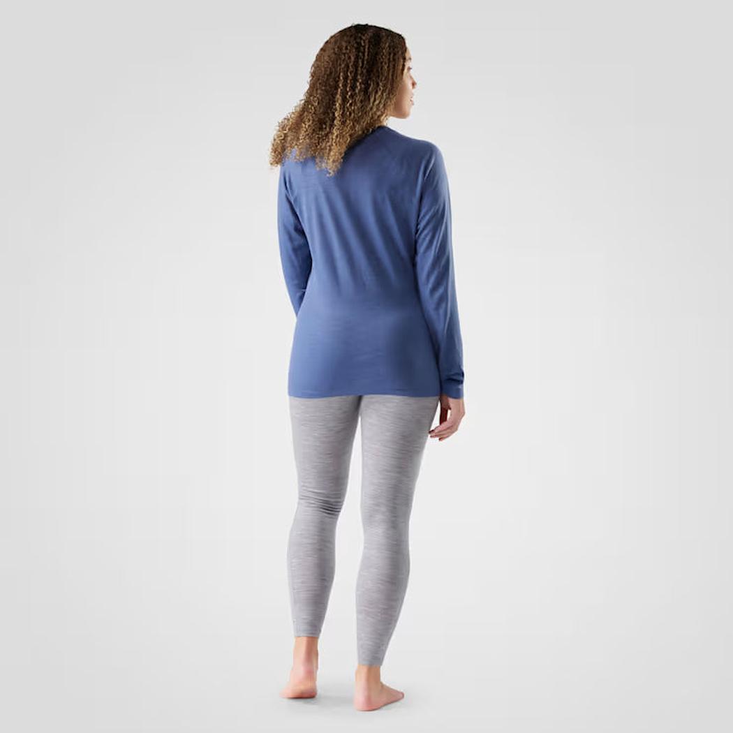 Back view of the Smartwool Women's Classic All-Season Merino Base Layer Crew in Green Tea on a model against a plain background.