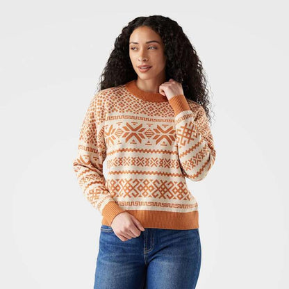 A woman wearing the Smartwool Women's Edgewood Heritage Crew Sweater in Light Gray poses against a plain white background.