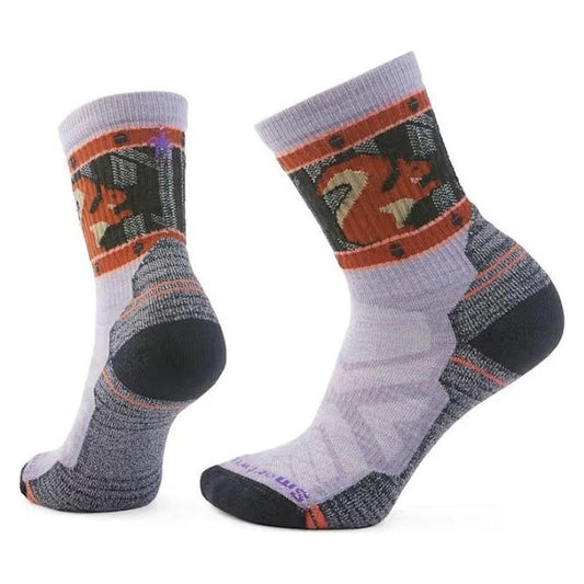 Side view of the Smartwool Women's Hike Light Cushion Squirrely Crew Socks in Purple Eclipse showing the squirrel graphic and cushioned heel against a white background.