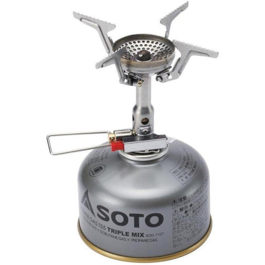 A top-down view of the Soto Outdoors Amicus camping stove with its igniter attached, sitting on a silver gas canister.