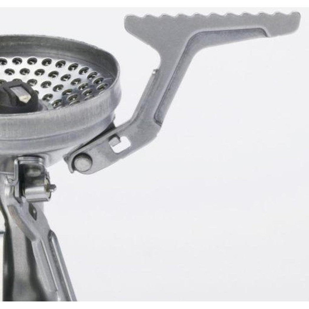 A close-up of the Soto Outdoors Amicus with Igniter stove showing the perforated cooking surface and foldable handle against a plain white background.