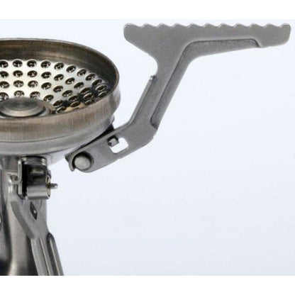 A close-up of the Soto Outdoors Amicus without Igniter stove with a serrated control lever, photographed from the side against a plain white background.