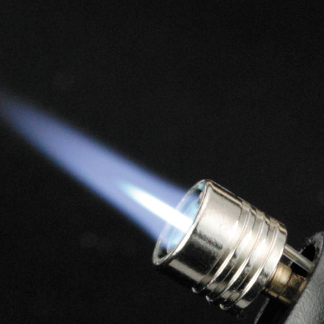 A close-up of the Soto Outdoors Pocket Torch with a blue flame against a black background.