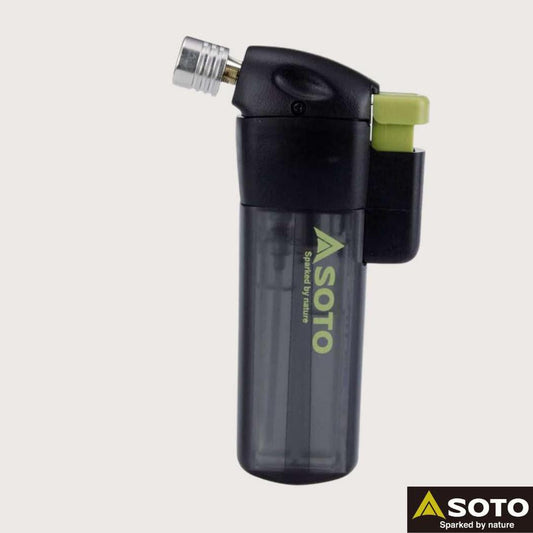 A side view of the Soto Outdoors Pocket Torch with a black body and green accents against a plain white background.