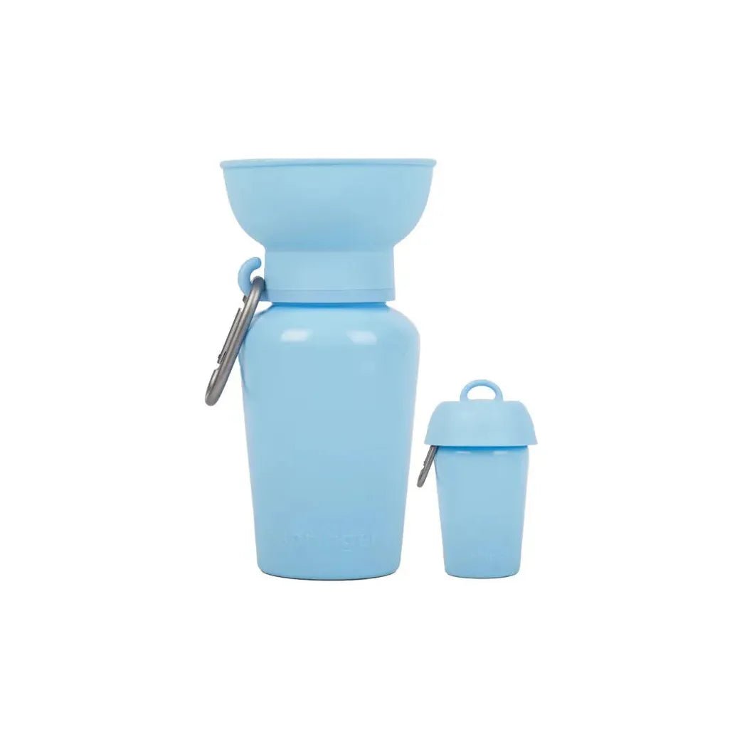 A side view of the black Springer Flip Dog Travel Bottle with a carabiner and a matching smaller cup against a white background.