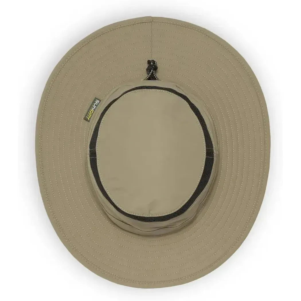 A top-down view of the Sunday Afternoons Cruiser Hat in Cream/Sand with a black band and a small tag on the left side.