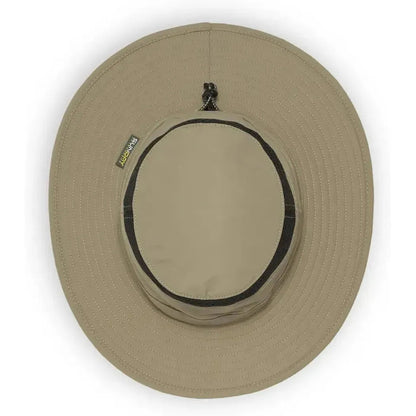 A top-down view of the Sunday Afternoons Cruiser Hat in Cream/Sand with a black band and a small tag on the left side.