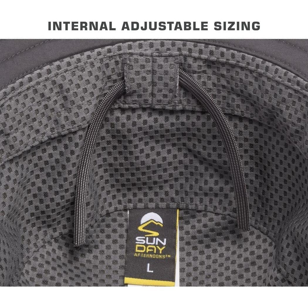 The interior of a Carbon Sunday Afternoons Ultra Storm Bucket hat shows internal adjustable sizing and a size L tag.
