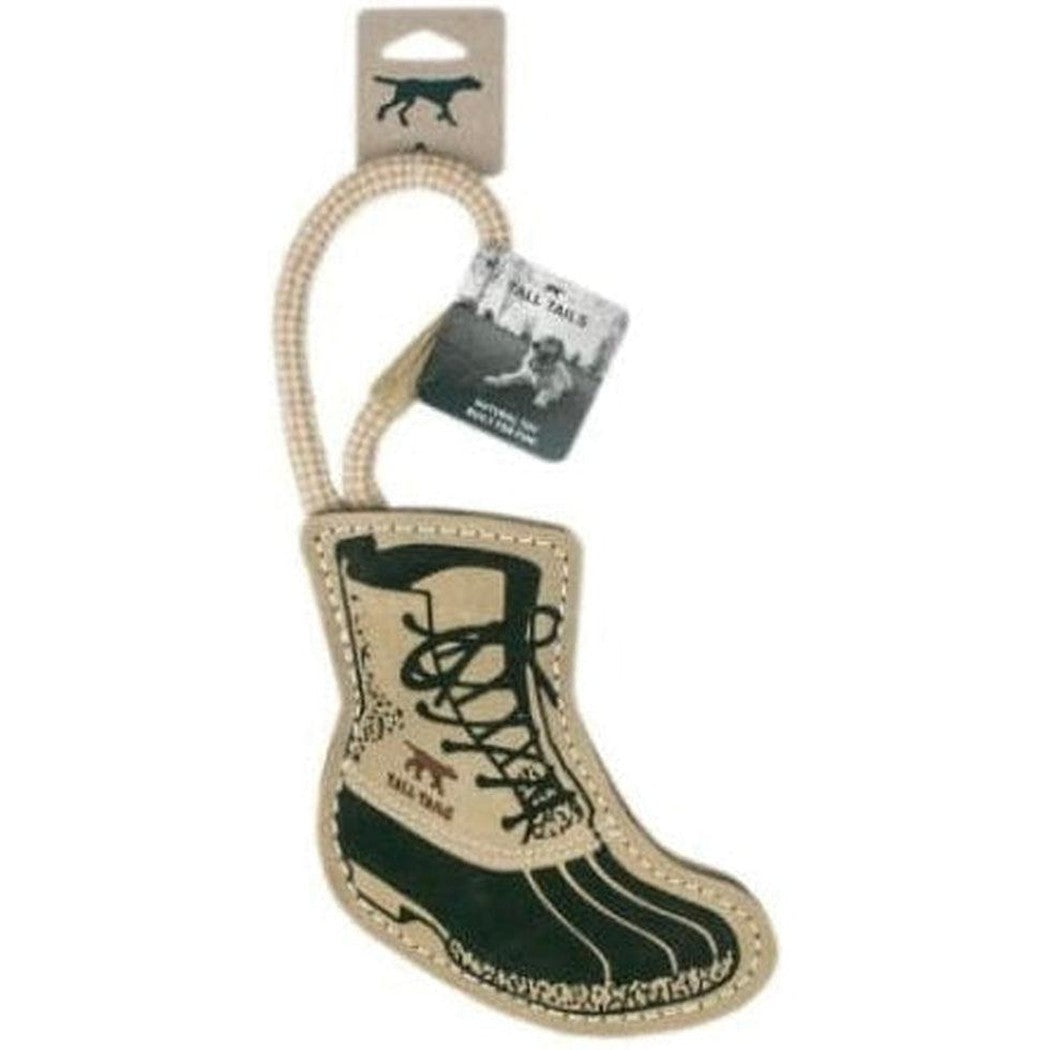 A natural leather boot tug toy from Tall Tails hangs from a rope with a dog tag visible, shown against a white background.