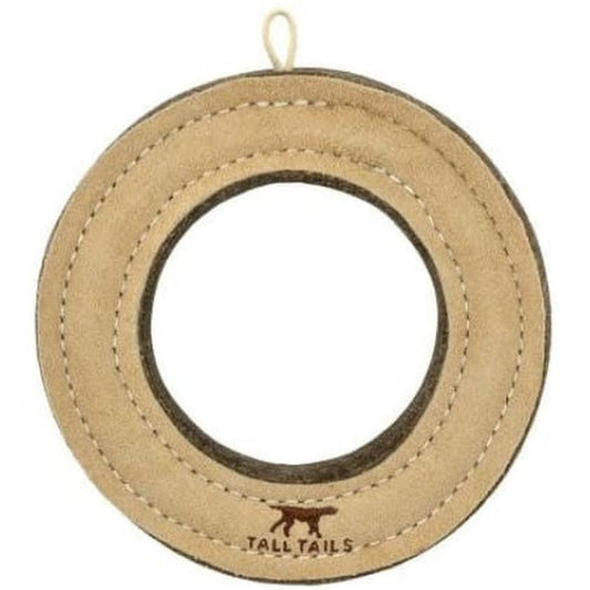 A natural leather ring toy from Tall Tails with a hanging loop and a dog logo at the bottom.