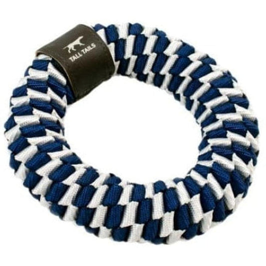 A close-up of the Tall Tails Navy Braider Ring Toy with a black tag, showing the braided navy and white pattern against a white background.