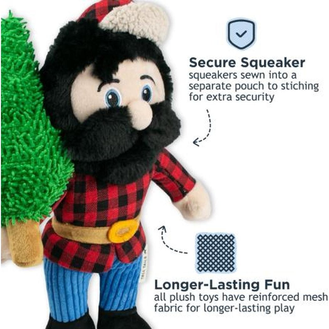 A close-up of the Tall Tails Paul Bunyan Rope Body Dog Toy shows its secure squeaker feature and reinforced mesh fabric, with a green tree prop in the background.