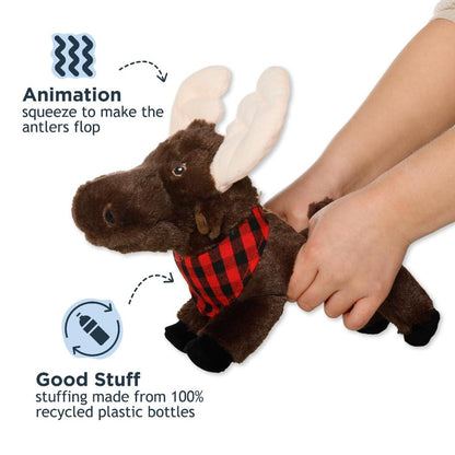 A side view of the Tall Tails Plush Animated Moose Toy showing the antlers flopping feature and hands squeezing it, against a white background.